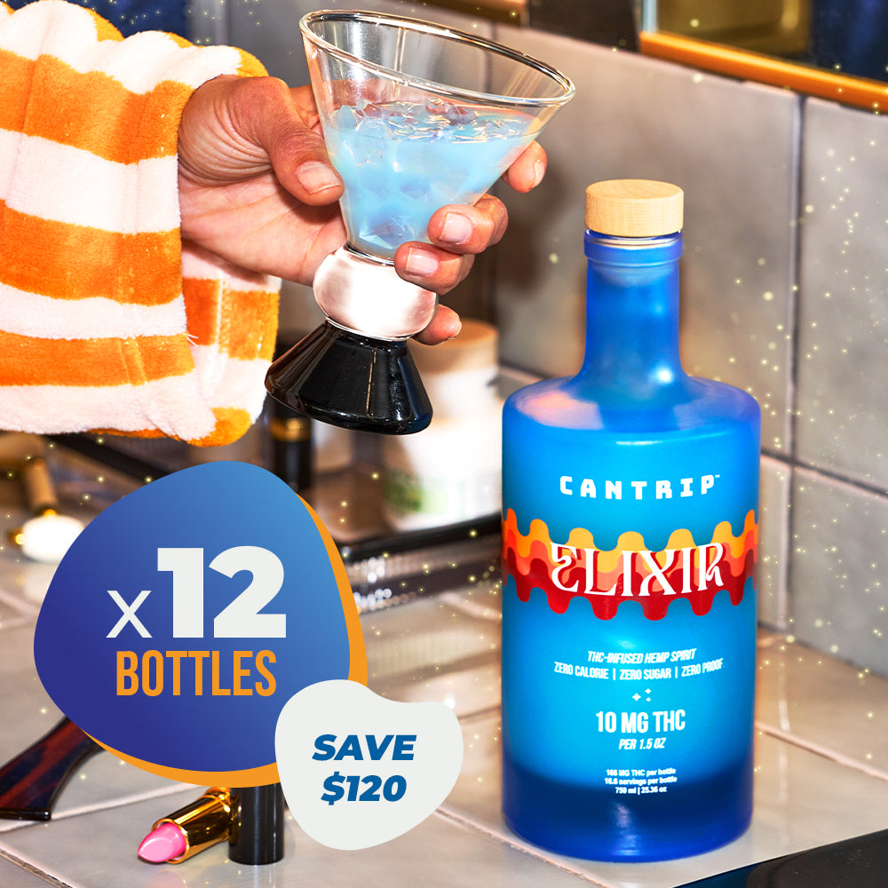 Blue bottle labeled 'Cantrip Elixir' with a cocktail and promotional text on a kitchen counter.