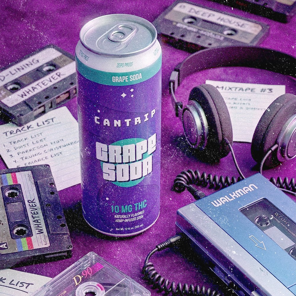 Cantrip Grape Soda THC can surrounded by a boombox, cassette tapes, headphones, and a CD player on a purple fabric background