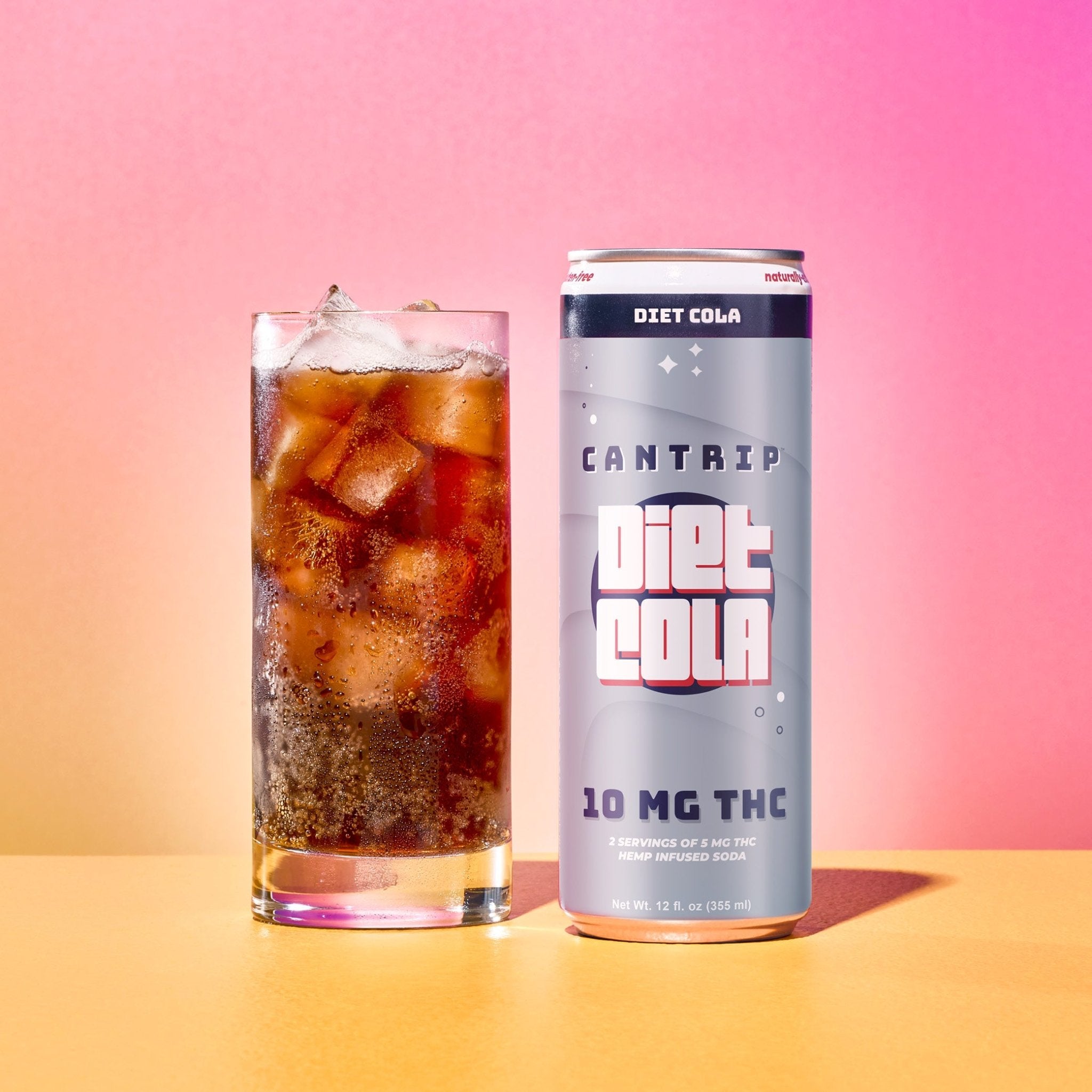 A silver can of Cantrip THC Diet Cola (10 MG) next to a glass of soda over ice. The can reads, 