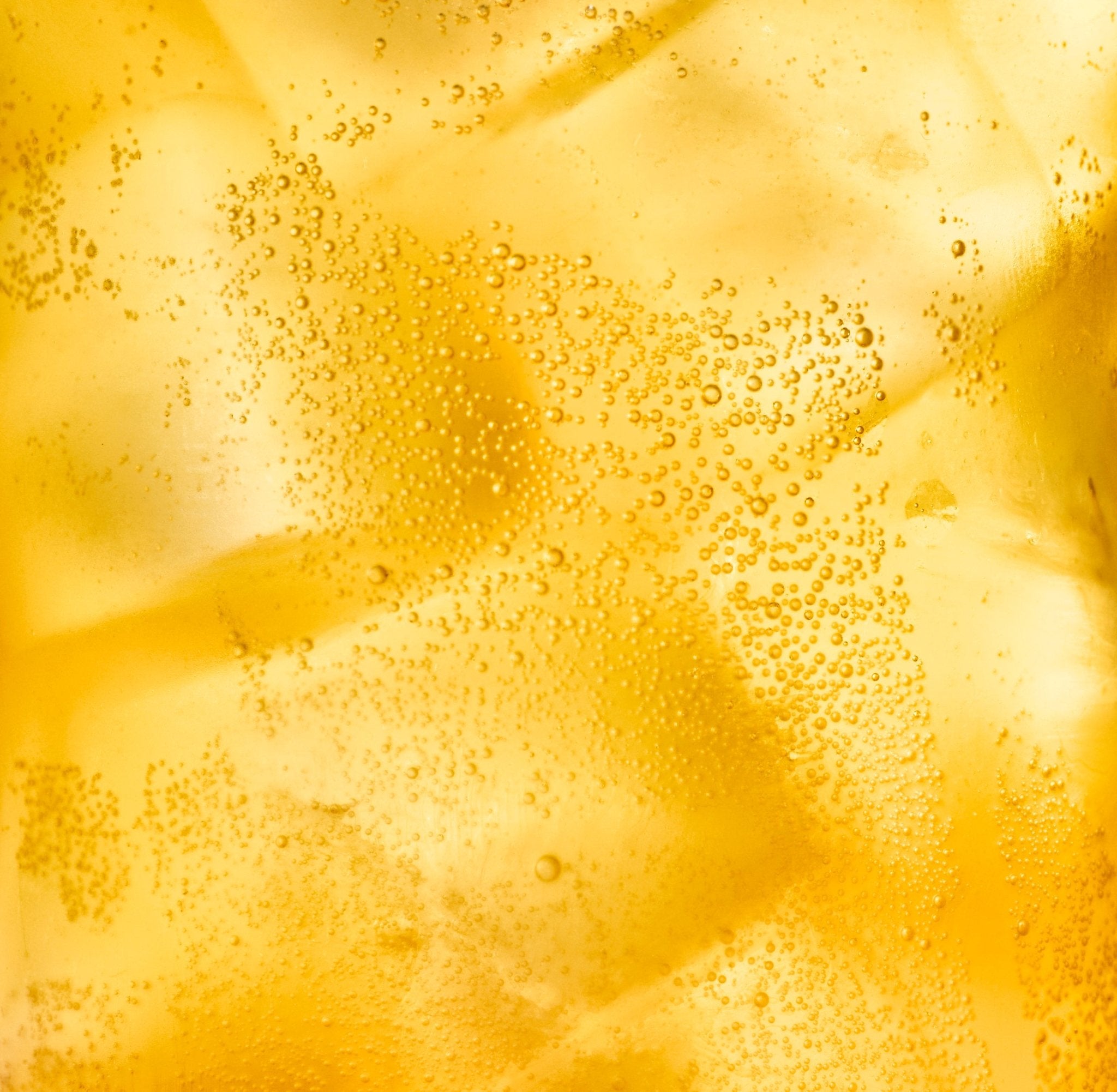 A close-up of a bubbly seltzer on ice